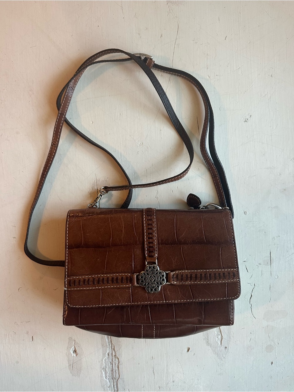Brown Croc-Embossed Crossbody Bag with Decorative Medallion